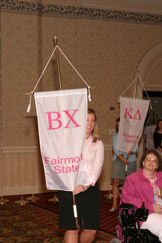 Unidentified Phi Mu With Beta Chi Chapter Banner in Convention Parade of Flags Photograph, July 9, 2004 (Image)