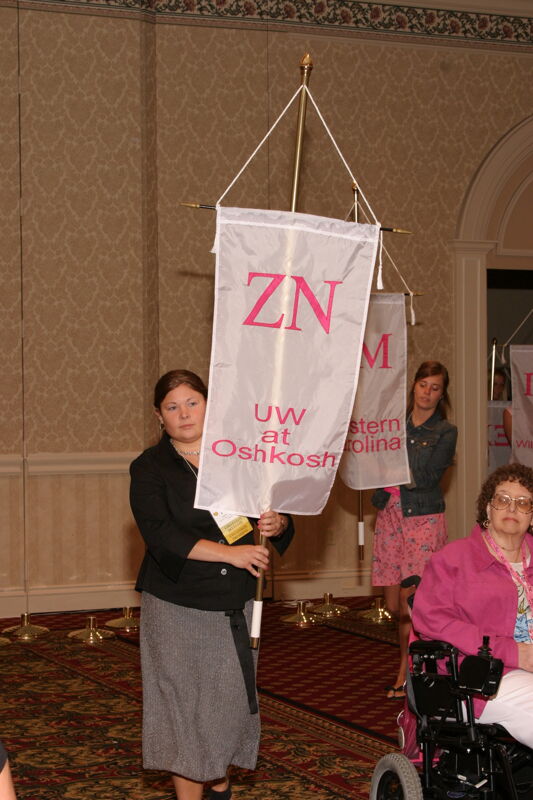Unidentified Phi Mu With Zeta Nu Chapter Banner in Convention Parade of Flags Photograph, July 9, 2004 (Image)
