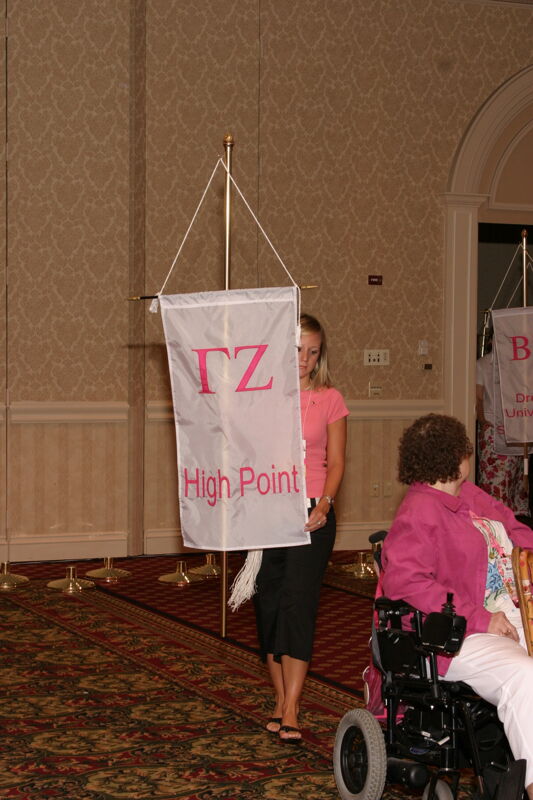 Unidentified Phi Mu With Gamma Zeta Chapter Banner in Convention Parade of Flags Photograph, July 9, 2004 (Image)