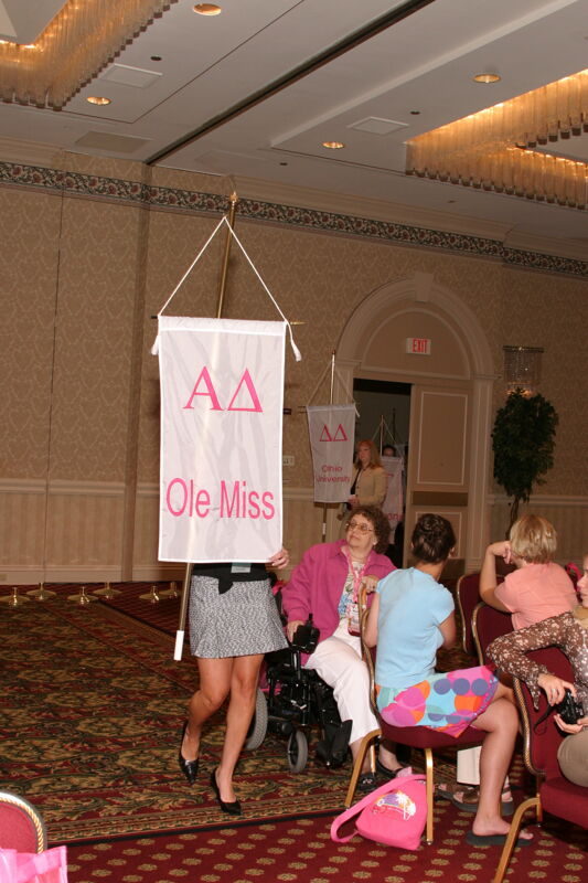 Unidentified Phi Mu With Alpha Delta Chapter Banner in Convention Parade of Flags Photograph, July 9, 2004 (Image)