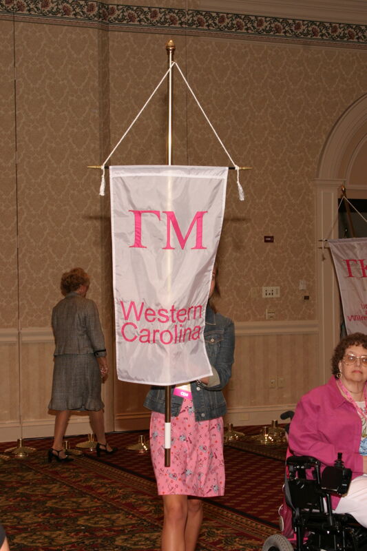 Unidentified Phi Mu With Gamma Mu Chapter Banner in Convention Parade of Flags Photograph, July 9, 2004 (Image)