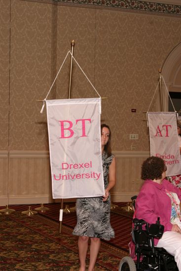 Unidentified Phi Mu With Beta Tau Chapter Banner in Convention Parade of Flags Photograph, July 9, 2004 (image)