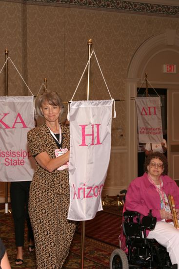 Pamela Wadsworth With Eta Iota Chapter Banner in Convention Parade of Flags Photograph, July 9, 2004 (image)