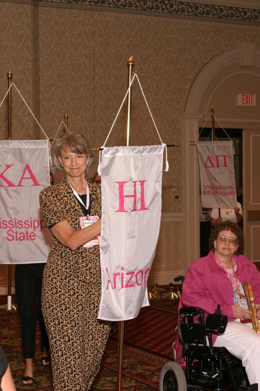 Pamela Wadsworth With Eta Iota Chapter Banner in Convention Parade of Flags Photograph, July 9, 2004 (Image)