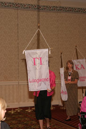 Unidentified Phi Mu With Gamma Iota Chapter Banner in Convention Parade of Flags Photograph, July 9, 2004 (image)