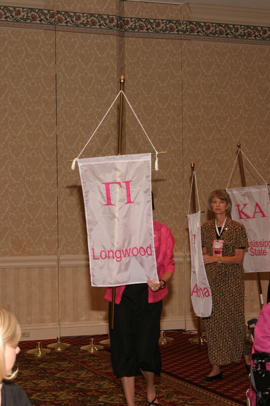 Unidentified Phi Mu With Gamma Iota Chapter Banner in Convention Parade of Flags Photograph, July 9, 2004 (Image)