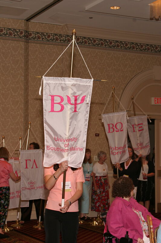 Unidentified Phi Mu With Beta Psi Chapter Banner in Convention Parade of Flags Photograph, July 9, 2004 (Image)