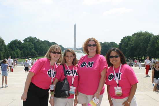 Group of Four in Phi Mu Shirts by Washington Monument During Convention Photograph 2, July 10, 2004 (image)