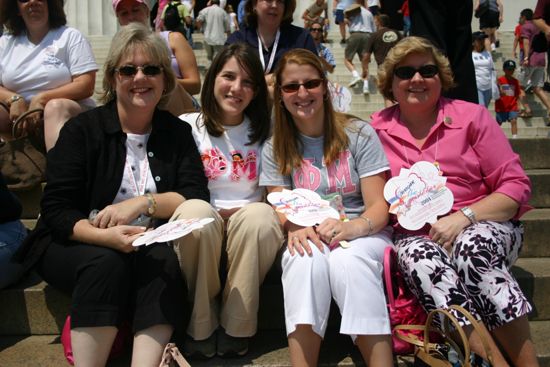 Four Phi Mus on Lincoln Memorial Steps During Convention Photograph 1, July 10, 2004 (image)