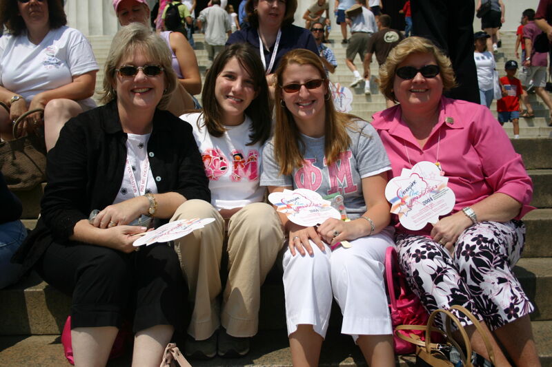 Four Phi Mus on Lincoln Memorial Steps During Convention Photograph 1, July 10, 2004 (Image)