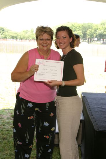 Kathy Williams and Alpha Omicron Chapter Member With Certificate at Convention Outdoor Luncheon Photograph 1, July 10, 2004 (image)