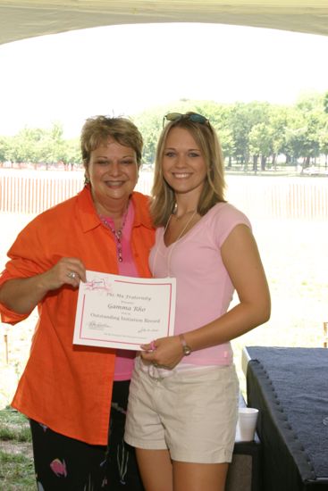 Kathy Williams and Gamma Rho Chapter Member With Certificate at Convention Outdoor Luncheon Photograph, July 10, 2004 (image)