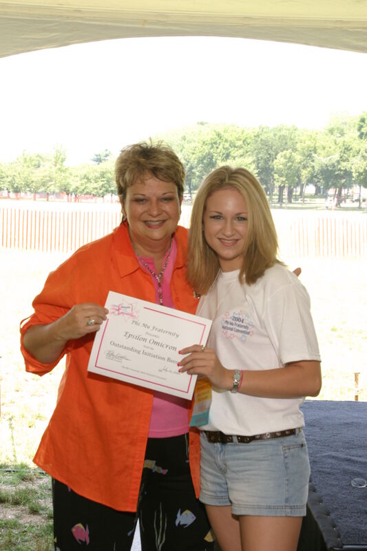 Kathy Williams and Epsilon Omicron Chapter Member With Certificate at Convention Outdoor Luncheon Photograph, July 10, 2004 (Image)