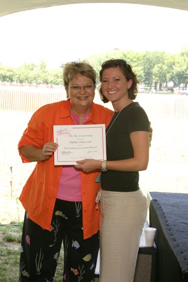 Kathy Williams and Alpha Omicron Chapter Member With Certificate at Convention Outdoor Luncheon Photograph 2, July 10, 2004 (image)