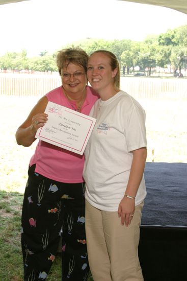 Kathy Williams and Epsilon Nu Chapter Member With Certificate at Convention Outdoor Luncheon Photograph 1, July 10, 2004 (image)