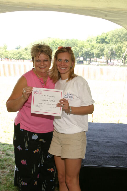 Kathy Williams and Kappa Sigma Chapter Member With Certificate at Convention Outdoor Luncheon Photograph, July 10, 2004 (Image)