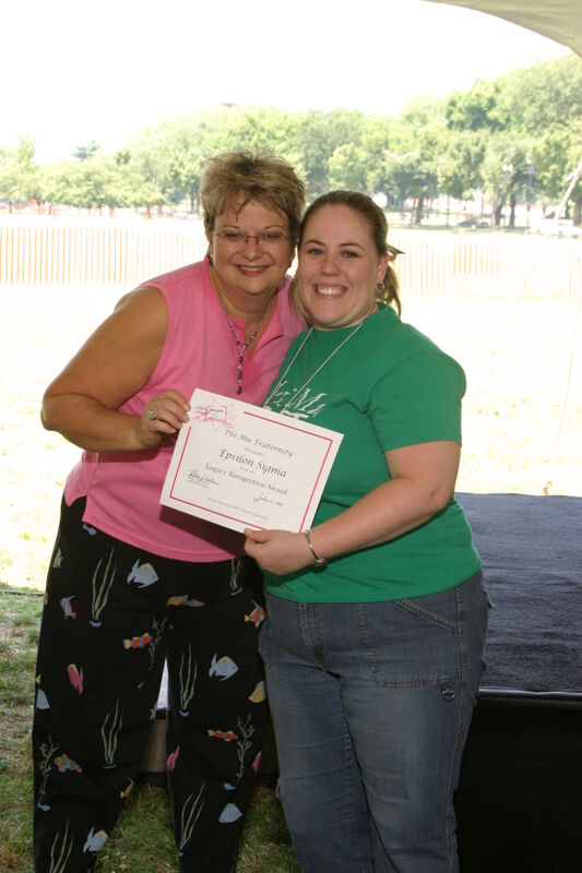 Kathy Williams and Epsilon Sigma Chapter Member With Certificate at Convention Outdoor Luncheon Photograph, July 10, 2004 (Image)