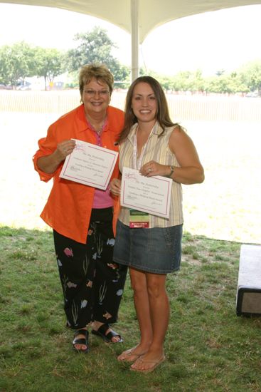 Kathy Williams and Unidentified With Certificates at Convention Outdoor Luncheon Photograph, July 10, 2004 (image)