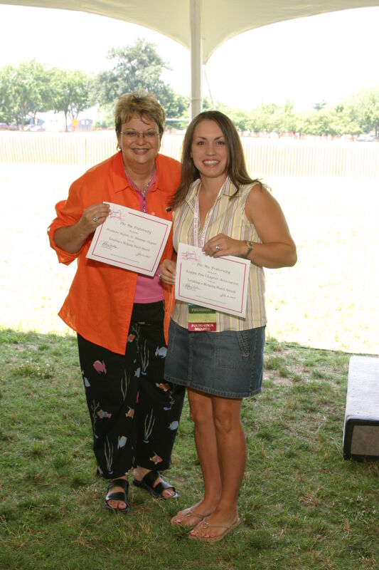 Kathy Williams and Unidentified With Certificates at Convention Outdoor Luncheon Photograph, July 10, 2004 (Image)