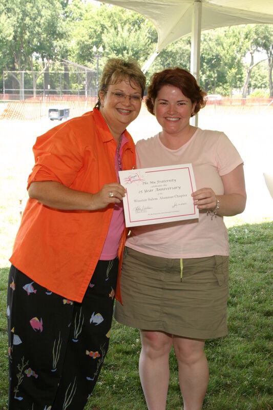 Kathy Williams and Winston-Salem Alumna With Certificate at Convention Outdoor Luncheon Photograph, July 10, 2004 (Image)