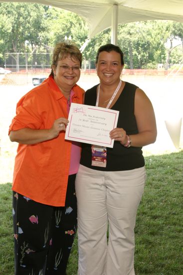 Kathy Williams and Miami Alumna With Certificate at Convention Outdoor Luncheon Photograph, July 10, 2004 (image)