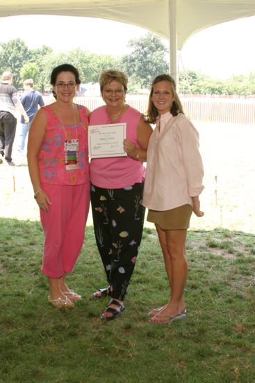 Griffis, Williams, and Unidentified With Certificate at Convention Outdoor Luncheon Photograph, July 10, 2004 (image)