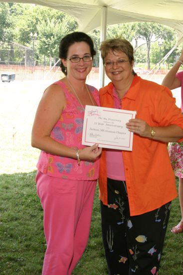 Kathy Williams and Mary Helen Griffis With Certificate at Convention Outdoor Luncheon Photograph, July 10, 2004 (image)