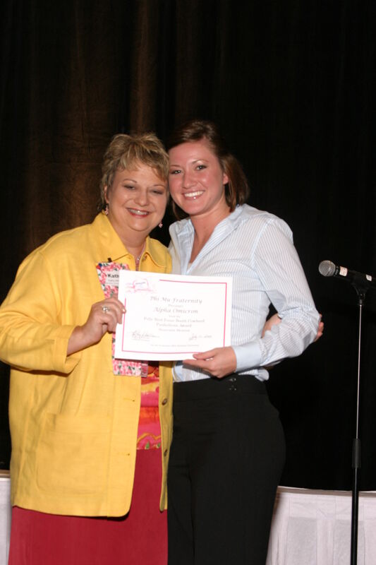 Kathy Williams and Alpha Omicron Chapter Member With Certificate at Convention Sisterhood Luncheon Photograph, July 8-11, 2004 (Image)