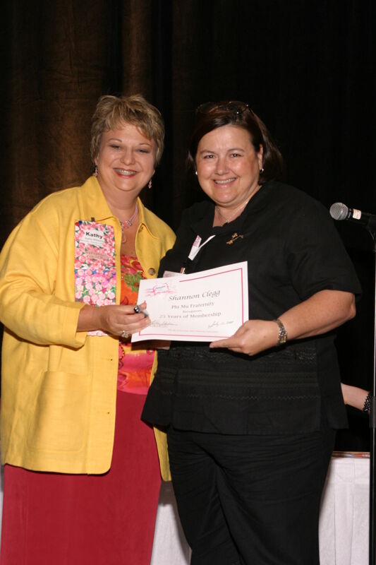 Kathy Williams and Shannon Clegg With Certificate at Convention Sisterhood Luncheon Photograph, July 8-11, 2004 (Image)