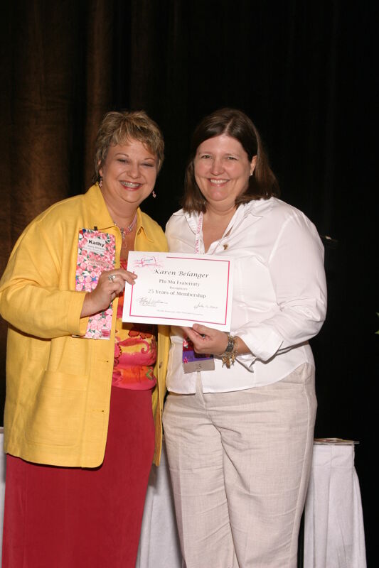 Kathy Williams and Karen Belanger With Certificate at Convention Sisterhood Luncheon Photograph, July 8-11, 2004 (Image)
