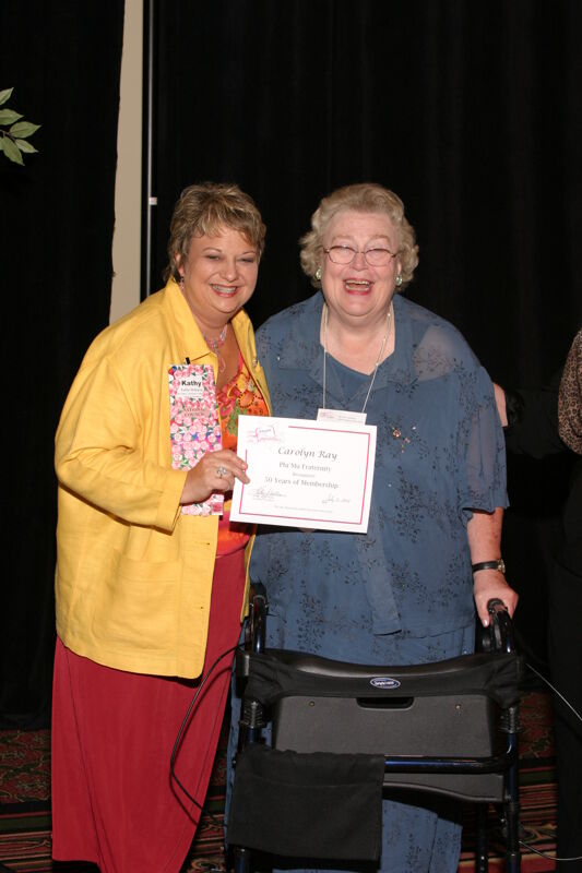 Kathy Williams and Carolyn Ray With Certificate at Convention Sisterhood Luncheon Photograph, July 8-11, 2004 (Image)