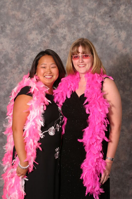 Two Unidentified Phi Mus in Feather Boas Convention Portrait Photograph, July 11, 2004 (Image)