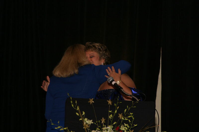 July 11 Cindy Lowden and Kathy Williams Hugging at Convention Carnation Banquet Photograph Image