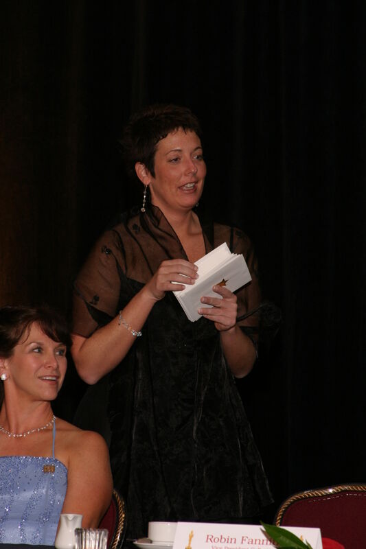 Jen Wooley With Envelopes at Convention Carnation Banquet Photograph, July 11, 2004 (Image)