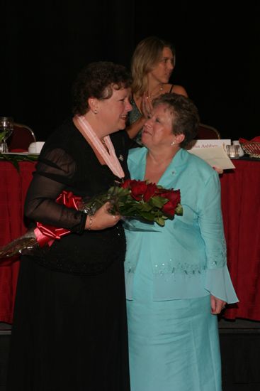 Audrey Jankucic and Unidentified Phi Mu Hugging at Convention Carnation Banquet Photograph 5, July 11, 2004 (image)