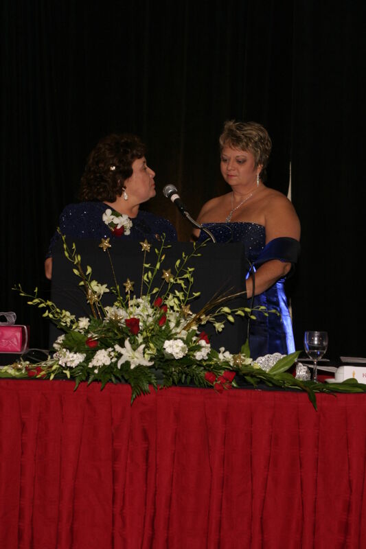 Mary Jane Johnson Speaking to Kathy Williams at Convention Carnation Banquet Photograph 1, July 11, 2004 (Image)