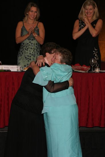 Audrey Jankucic and Unidentified Phi Mu Hugging at Convention Carnation Banquet Photograph 2, July 11, 2004 (image)