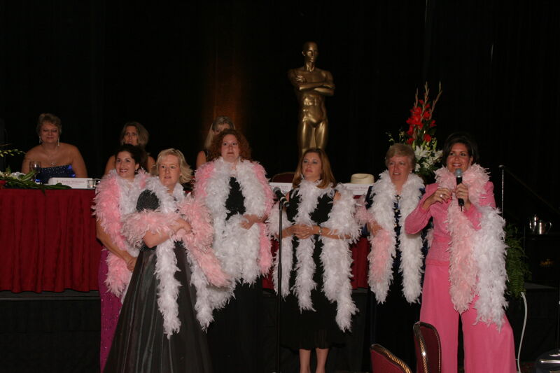 Choir in Feather Boas at Convention Carnation Banquet Photograph 2, July 11, 2004 (Image)