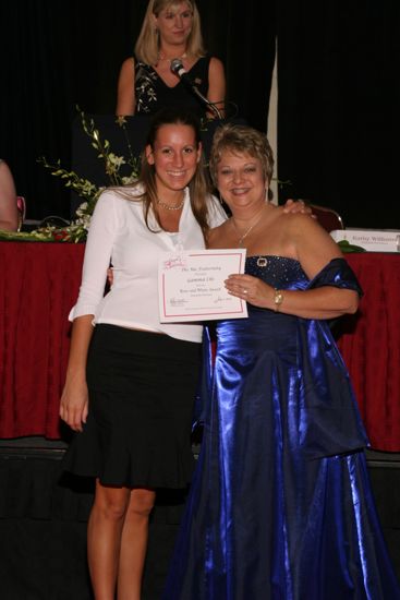 Kathy Williams and Gamma Chi Chapter Member With Certificate at Convention Carnation Banquet Photograph, July 11, 2004 (image)