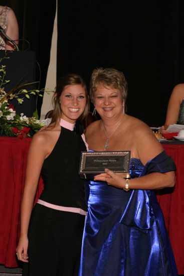 Kathy Williams and Unidentified With Award at Convention Carnation Banquet Photograph 18, July 11, 2004 (image)