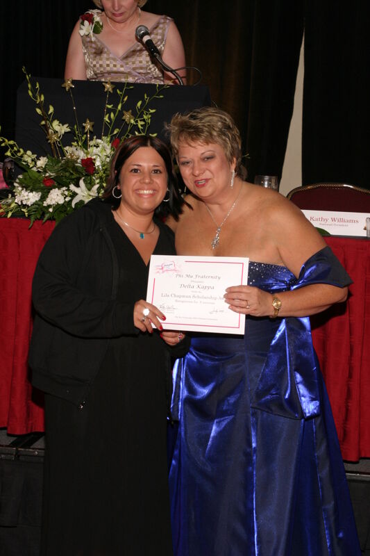 Kathy Williams and Delta Kappa Chapter Member With Certificate at Convention Carnation Banquet Photograph, July 11, 2004 (Image)