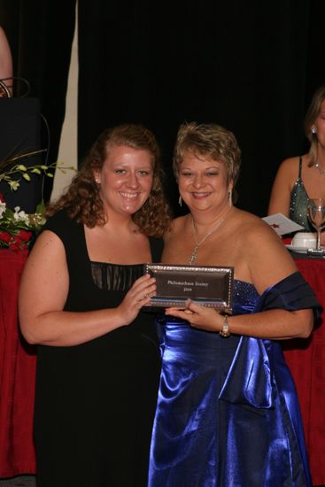 Kathy Williams and Unidentified With Award at Convention Carnation Banquet Photograph 19, July 11, 2004 (image)