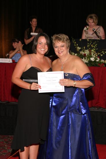 Kathy Williams and Kappa Sigma Chapter Member With Certificate at Convention Carnation Banquet Photograph, July 11, 2004 (image)