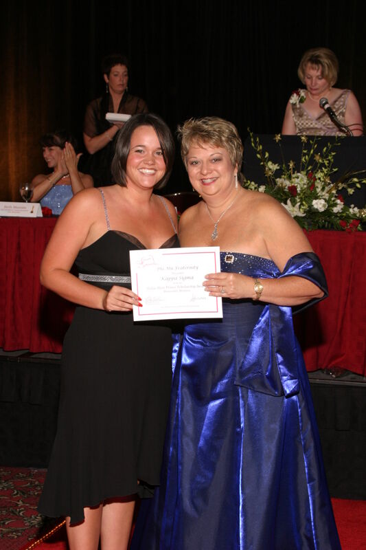 Kathy Williams and Kappa Sigma Chapter Member With Certificate at Convention Carnation Banquet Photograph, July 11, 2004 (Image)