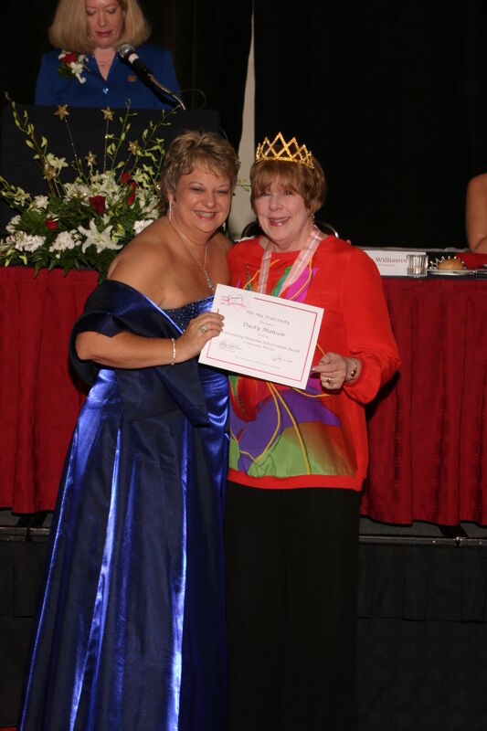 Kathy Williams and Dusty Manson With Certificate at Convention Carnation Banquet Photograph, July 11, 2004 (Image)