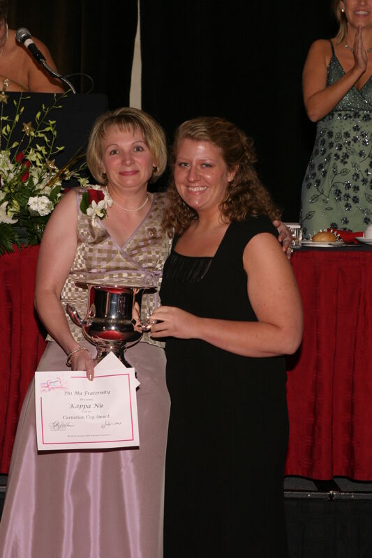 Robin Fanning and Kappa Nu Chapter Member With Award at Convention Carnation Banquet Photograph, July 11, 2004 (Image)