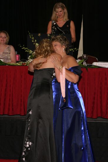 Kathy Williams Hugging Katie Burcham at Convention Carnation Banquet Photograph, July 11, 2004 (image)