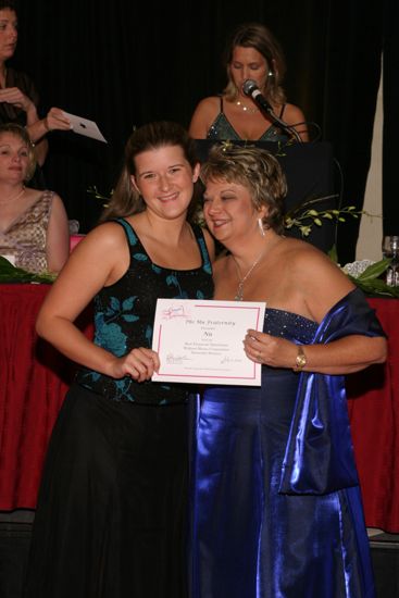 Kathy Williams and Nu Chapter Member With Certificate at Convention Carnation Banquet Photograph, July 11, 2004 (image)