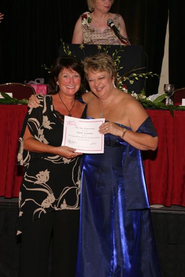 Kathy Williams and Alpha Gamma Chapter Member With Certificate at Convention Carnation Banquet Photograph, July 11, 2004 (image)