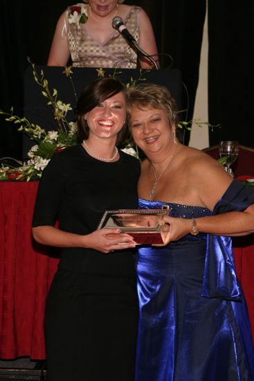 Kathy Williams and Unidentified With Award at Convention Carnation Banquet Photograph 16, July 11, 2004 (image)